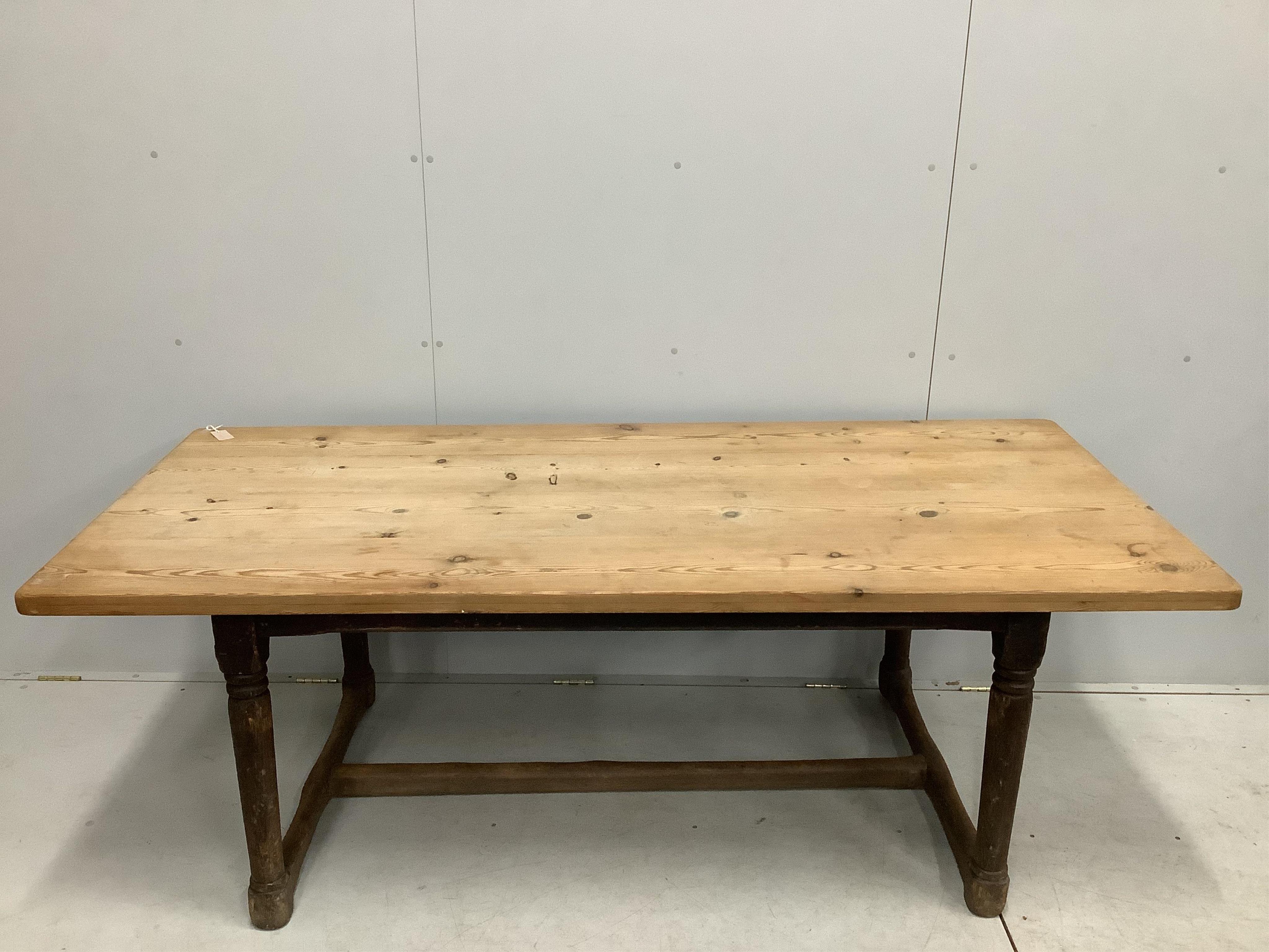 An 18th century oak refectory dining table with later pine top, width 206cm, depth 91cm, height 72cm. Condition - poor to fair